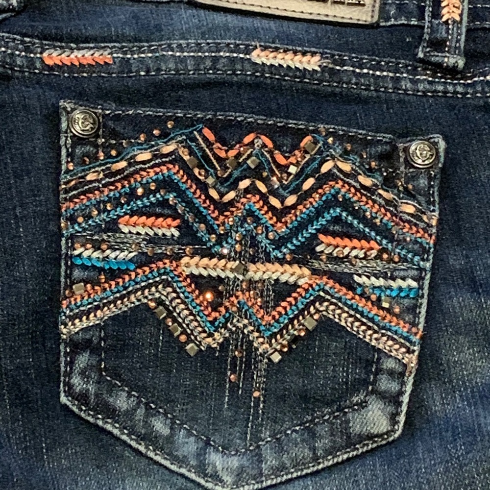 Grace in LA jeans, fancy stitched pockets